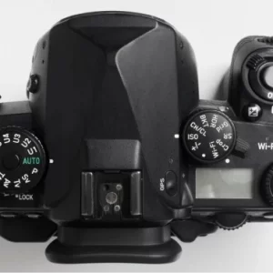 Hand holding photo camera